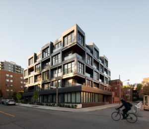 The checkerboard style architecture activates three streets at the intersection.