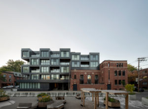 Carré des Arts, a distinctive residential project featuring Sid Lee Architecture’s signature architectural style, composed of stacked cubes in a grid formation, integrated into a former Montreal Church.