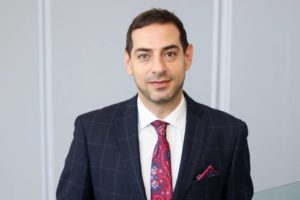 A man against a white background - Brock University researcher, and associate professor of engineering, Amir Mofidi.