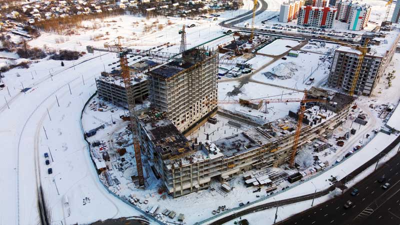 Aerial view of the snow-covered construction site of a Calgary-area medical facility.