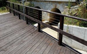 A cable railing in an industrial setting, capable of enhancing safety by increasing visibility.