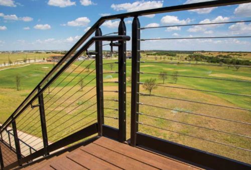 A swageless cable railing system, which does not require painting or staining, by the side of a staircase.