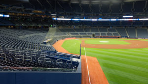 View from the stands: The quiet anticipation of an empty baseball field, awaiting the roar of fans and thrill of the game.