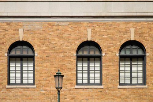 brick wall building with windows