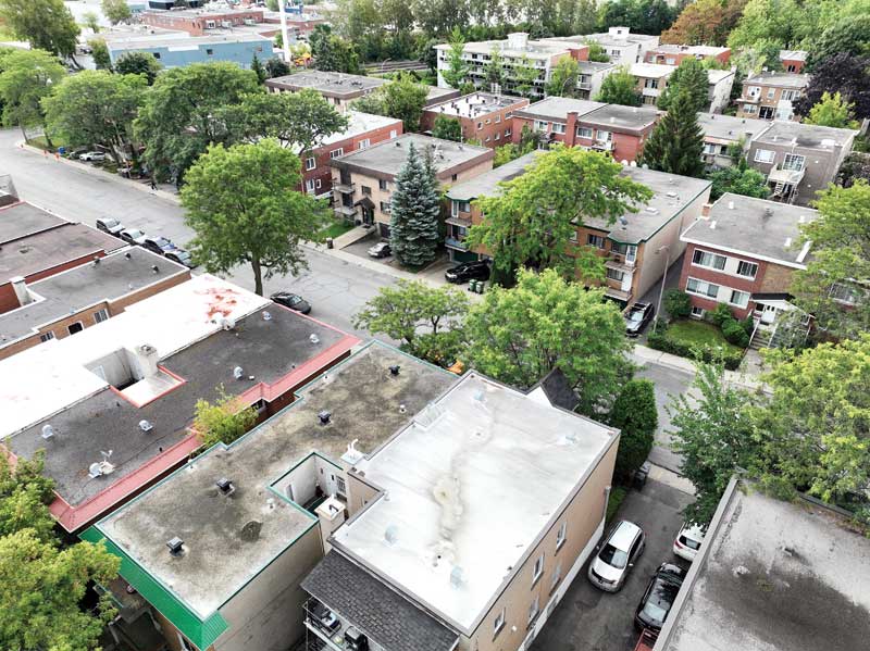 Aerial view of a residential neighbourhood showing the building's flat roofs.