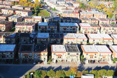 aerial view of townhouses with roof ventilators