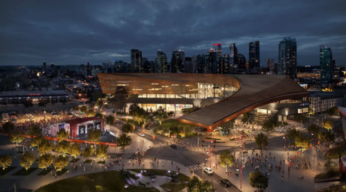 well-lit aerial view of a convention centre at night with several visitors