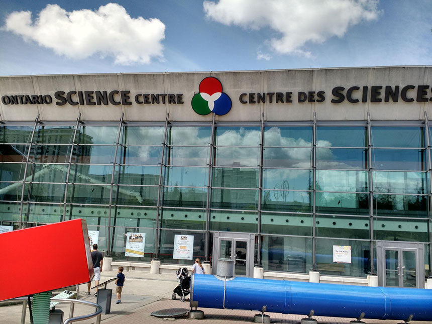 glass-clad building with 'Ontario Science Centre' written at the top