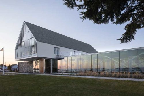 glass facade over a sloped roof building