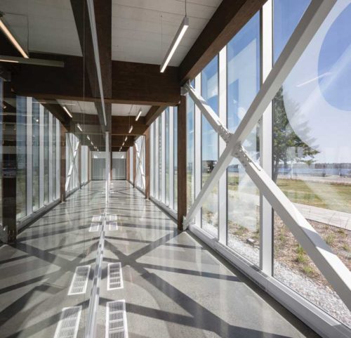 glass windows letting in sunshine in an empty building