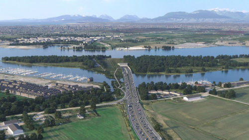 aerial view of a township with a long bridge