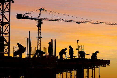 silhouette of construction workers