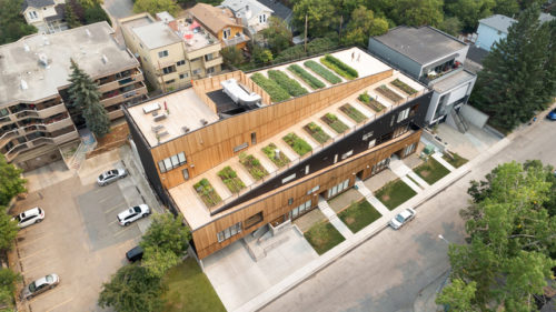 low rise building's aerial view with patches of green