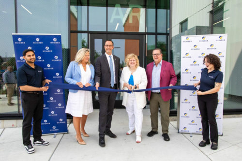 group of people at a ribbon cutting ceremony