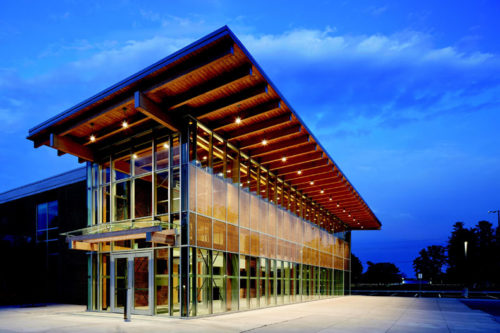 timber-clad building at night